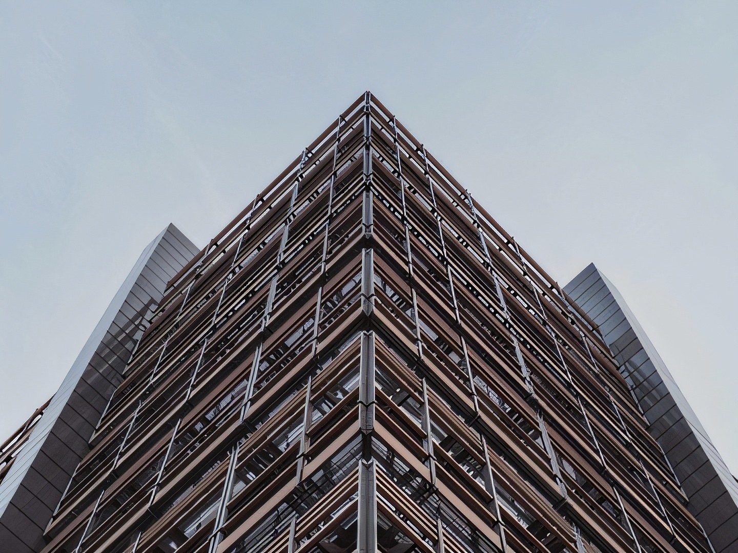 Modern glass architecture after 4x neural super-resolution: mullions and window frames are crisp